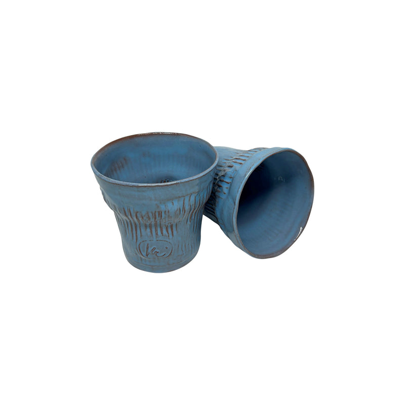 Biri devrik duran iki adet acik mavi seramik bardak_Two sky blue ceramic cups